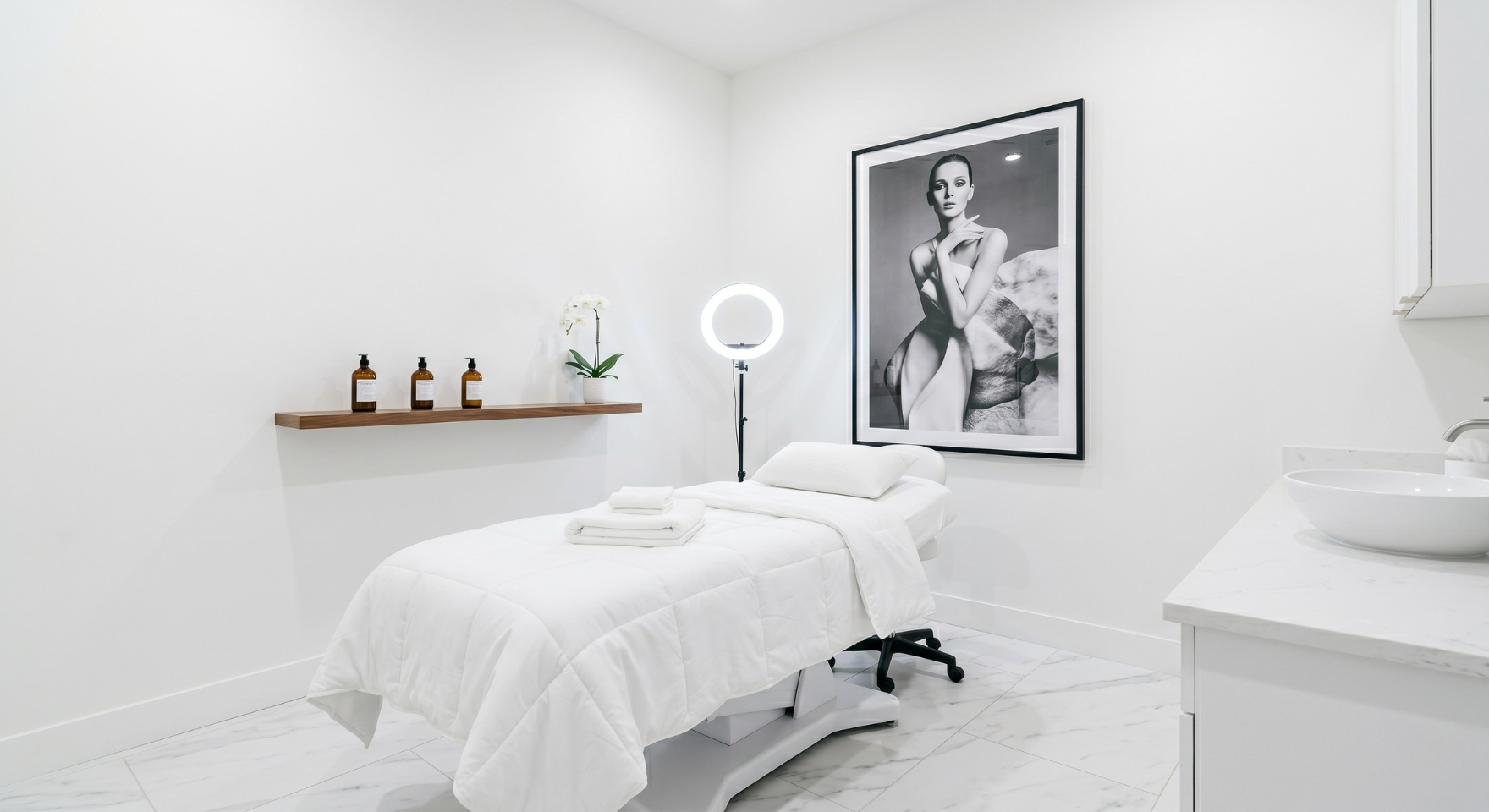 Luxury med spa treatment room with marble floors